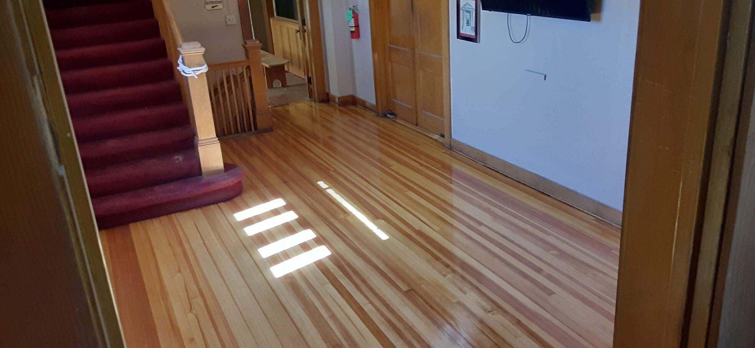 Freshly refinished hardwood hallway